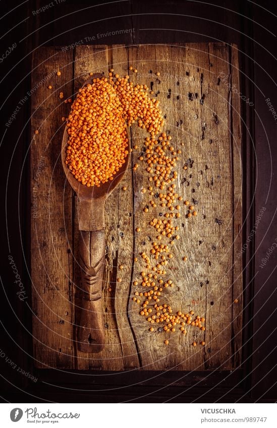 Rustic wooden spoon with dry red lentils Food Grain Nutrition Spoon Style Design Healthy Eating Nature Brown Orange Black Background picture Lentils Red