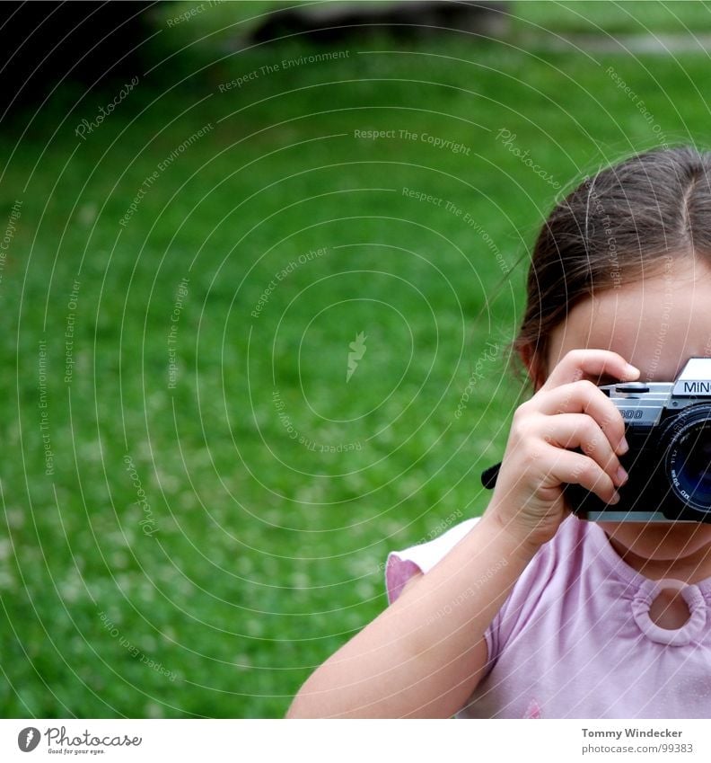 Photogen(s) Girl Child Talented Photography Take a photo Snapshot Hand Fingers Meadow Camera Braids To hold on Filming Analog Posture Education Minolta
