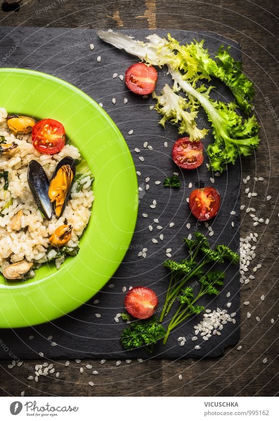 Risotto with mussels, salad leaves and tomatoes Food Seafood Vegetable Lettuce Salad Herbs and spices Nutrition Lunch Dinner Buffet Brunch Banquet Italian Food