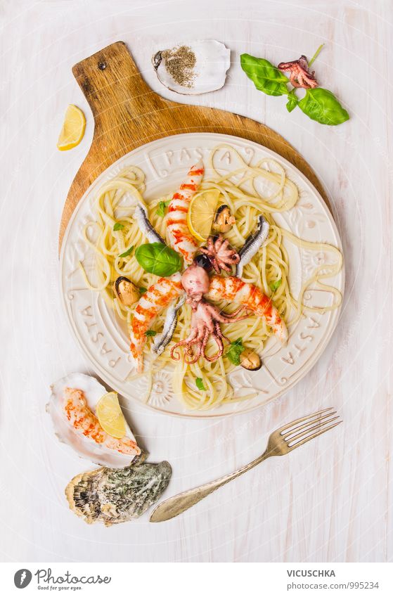 Spaghetti seafood with anchovies, shrimps and octopus Food Seafood Herbs and spices Cooking oil Lunch Banquet Crockery Plate Fork Style Design Healthy Eating
