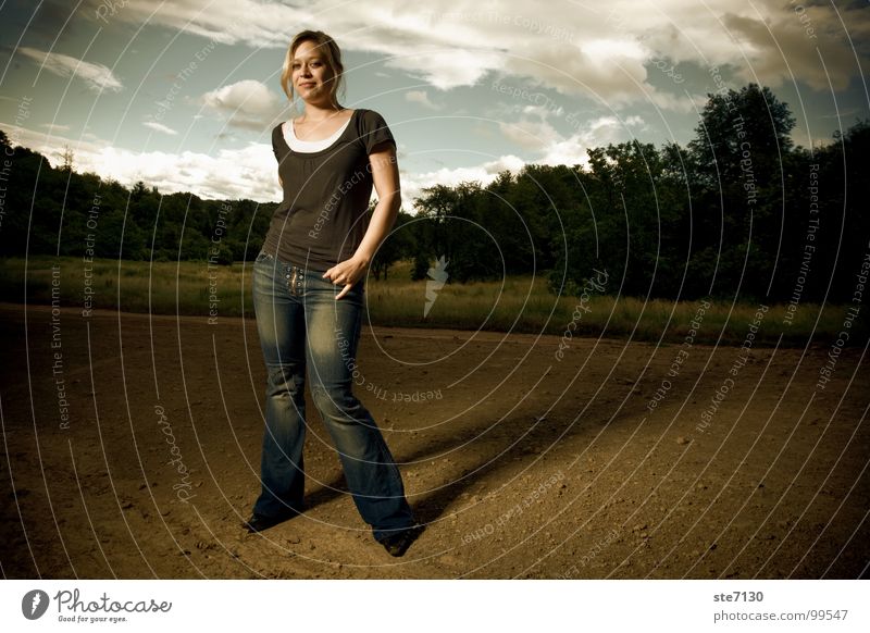Danielle with clouds in the background Blonde Clouds Rural Dramatic Green Meadow Dark Woman Americas Jeans Sky flash