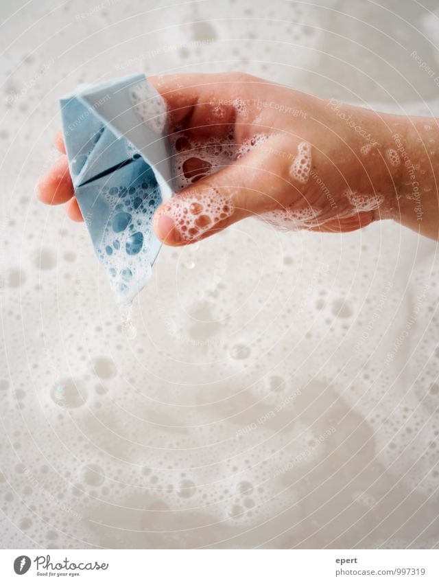 Sinking ships II Playing Children's game Paper boat Bathtub Hand Foam bath Water Swimming & Bathing Discover Joy Infancy Colour photo Interior shot Close-up