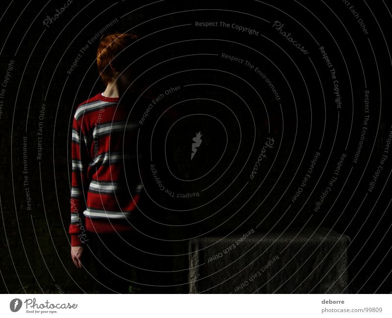 Boy standing in a dark tunnel with half his body in the shadow. Dark Tunnel Things Red Red-haired Striped Mysterious Crate Youth (Young adults) Shadow wnad