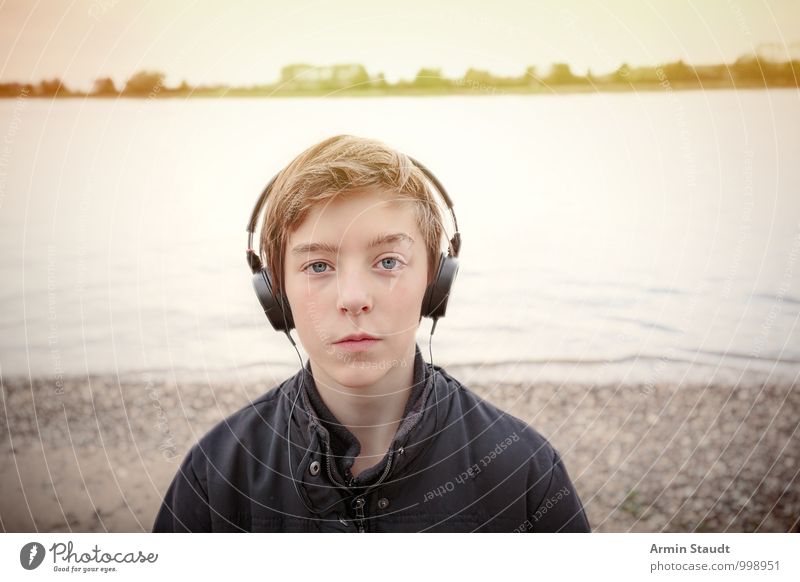 With headphones on the Rhine Lifestyle Headphones Human being Masculine Youth (Young adults) 1 13 - 18 years Child Landscape Sunrise Sunset Sunlight Autumn
